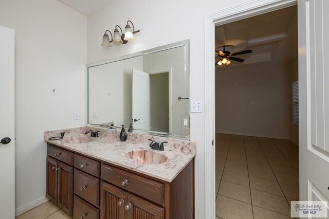 1508 W 20th St, Mission, TX 78572 - bathroom with tile patterned floors, double vanity, ceiling fan, and baseboards