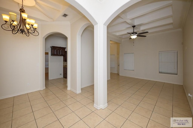 1508 W 20th St, Mission, TX 78572 - empty room with beamed ceiling, a ceiling fan, arched walkways, light tile patterned floors, and a chandelier