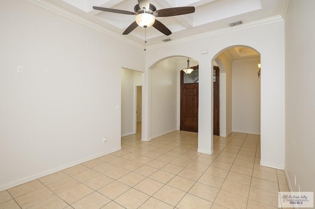 1508 W 20th St, Mission, TX 78572 - empty room featuring arched walkways, ornamental molding, a ceiling fan, light tile patterned flooring, and baseboards