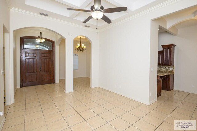 1508 W 20th St, Mission, TX 78572 - entrance foyer with arched walkways, light tile patterned flooring, ceiling fan, a chandelier, and ornamental molding