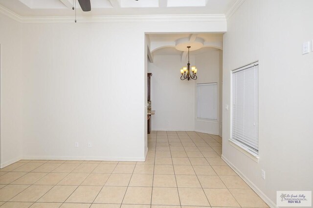 1508 W 20th St, Mission, TX 78572 - spare room featuring a chandelier, light tile patterned floors, a ceiling fan, and ornamental molding