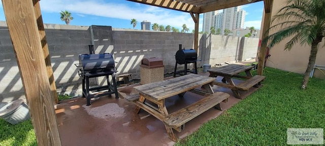 view of patio / terrace featuring a pergola and a grill