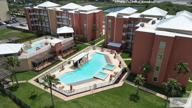 150 Padre Blvd Unit 204C, South Padre Island, TX 78597 - community pool featuring a patio, a community hot tub, and fence