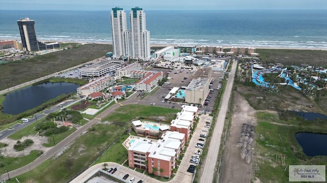 bird's eye view with a water view and a view of the beach