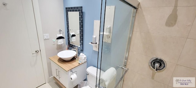 bathroom with vanity, toilet, and walk in shower