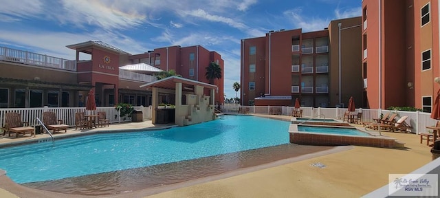 150 Padre Blvd Unit 204C, South Padre Island, TX 78597 - pool with fence, a community hot tub, and a patio area
