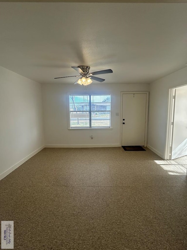 unfurnished room with ceiling fan