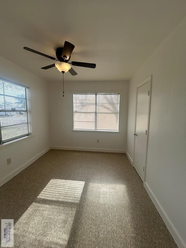 unfurnished room featuring ceiling fan, a healthy amount of sunlight, and carpet flooring