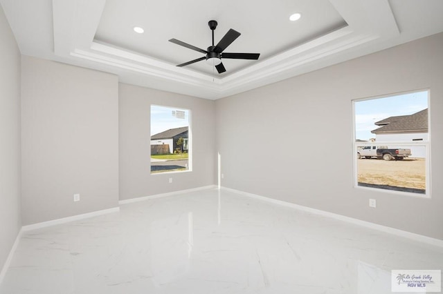 1202 Moses Dr, San Juan, TX 78589 - empty room with marble finish floor, baseboards, recessed lighting, and a raised ceiling