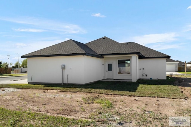1202 Moses Dr, San Juan, TX 78589 - back of house with a lawn and roof with shingles