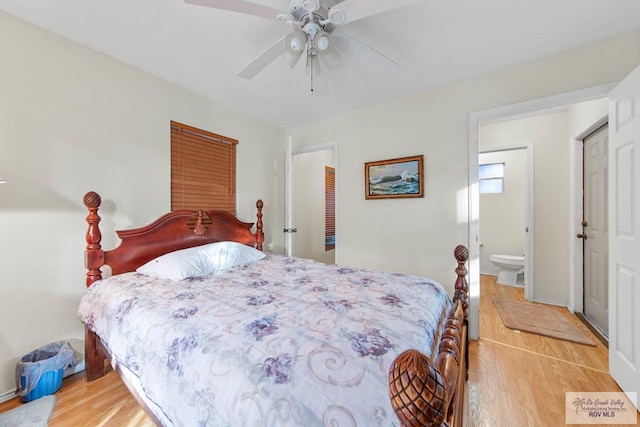 bedroom with connected bathroom, ceiling fan, and wood-type flooring