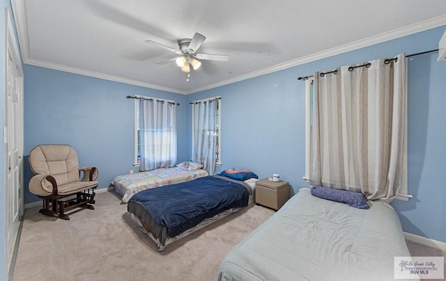 bedroom featuring carpet flooring, ceiling fan, and crown molding