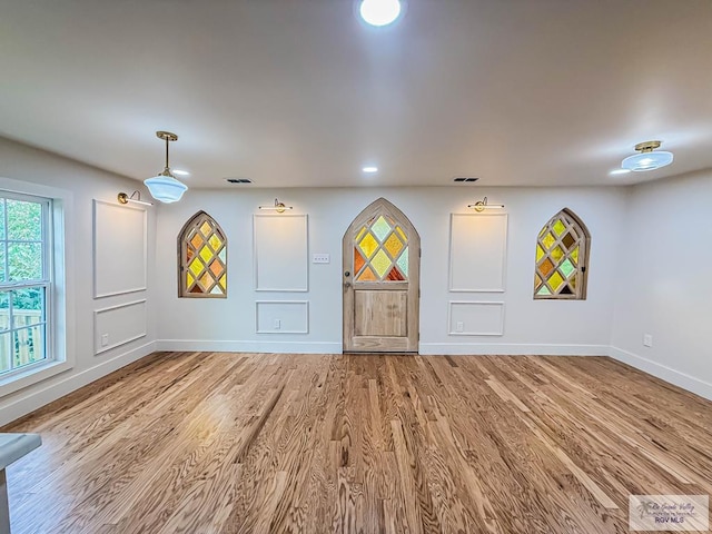1214 W Lincoln Ave Unit 22, Harlingen, TX 78550 - unfurnished living room with baseboards, wood finished floors, and recessed lighting