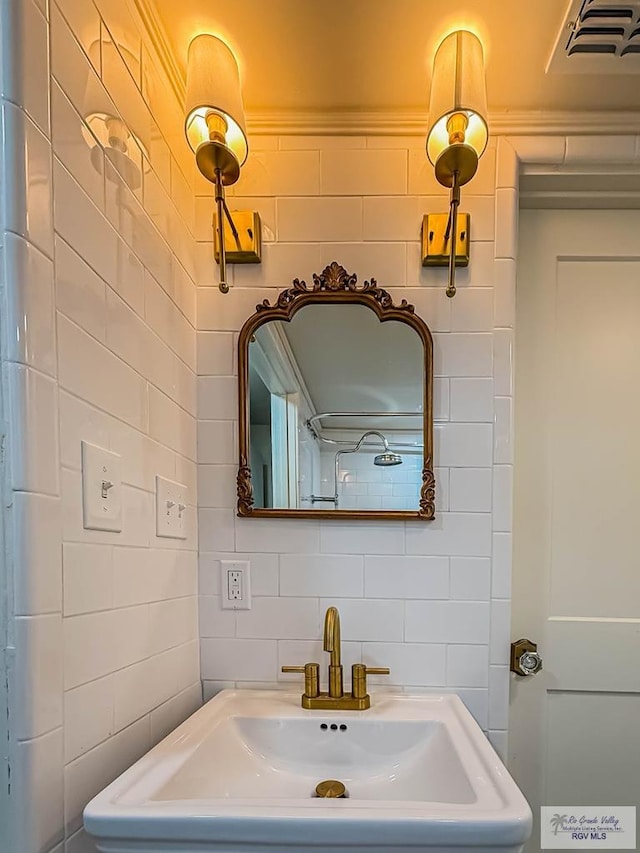 1214 W Lincoln Ave Unit 22, Harlingen, TX 78550 - bathroom featuring tile walls and a sink