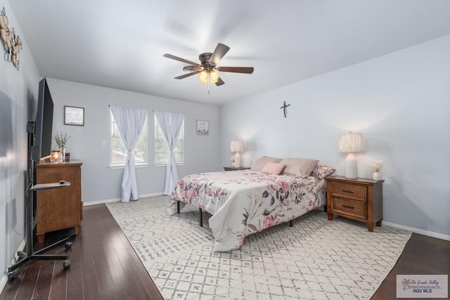 5503 Brazo Cir, Harlingen, TX 78552 - bedroom with baseboards, wood finished floors, and a ceiling fan