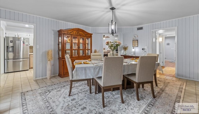 5503 Brazo Cir, Harlingen, TX 78552 - dining area with crown molding and light tile patterned flooring