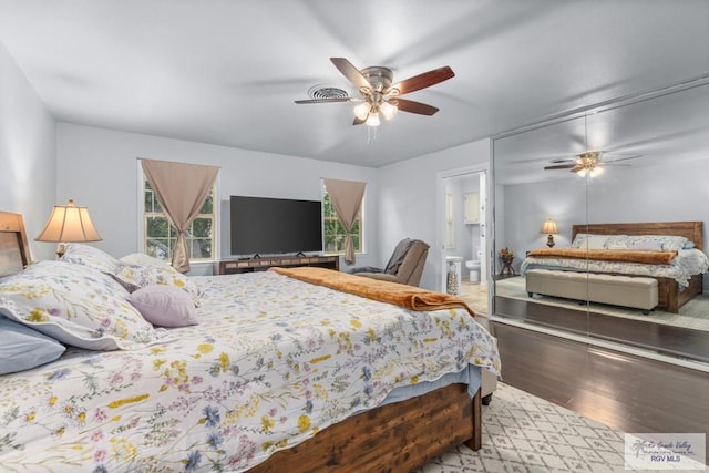 5503 Brazo Cir, Harlingen, TX 78552 - bedroom with wood finished floors, ceiling fan, and ensuite bath
