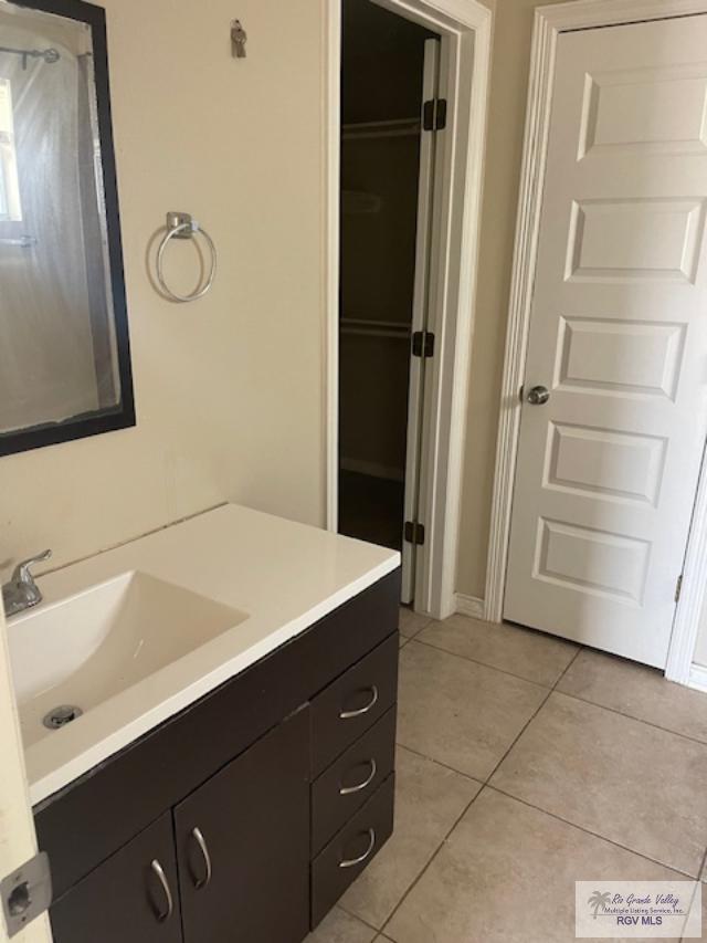 bathroom with vanity and tile patterned floors