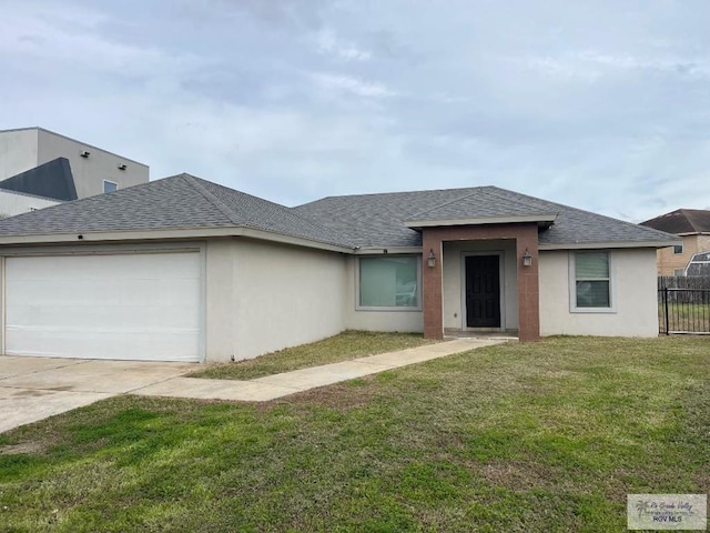 view of front facade with a garage and a front yard