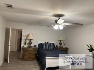 bedroom with ceiling fan and light hardwood / wood-style flooring