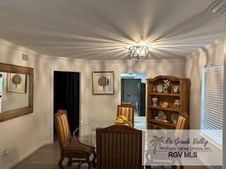 dining room with crown molding