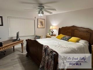 bedroom featuring hardwood / wood-style flooring and ceiling fan