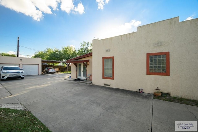 view of home's exterior featuring a carport