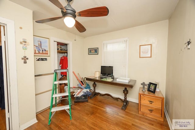 office with ceiling fan and hardwood / wood-style flooring