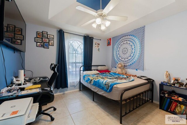 tiled bedroom with ceiling fan