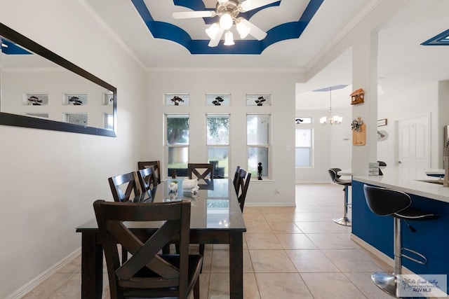 dining area with ceiling fan with notable chandelier, light tile patterned floors, and crown molding