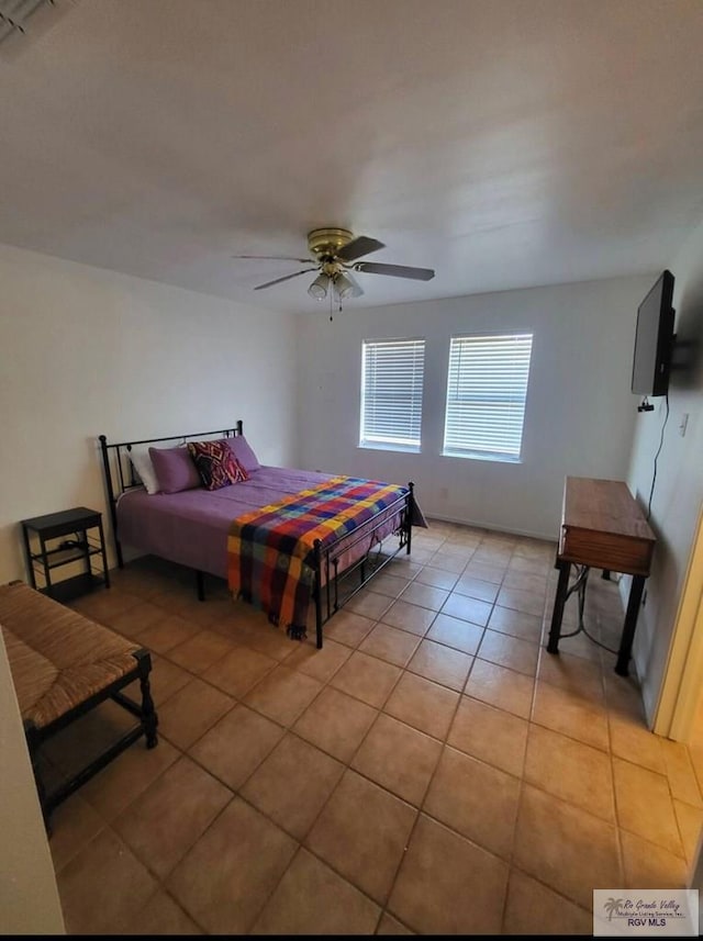 bedroom featuring light tile patterned floors and ceiling fan