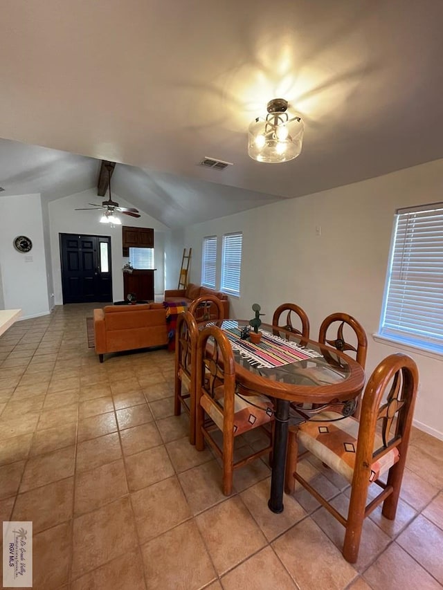 dining space featuring vaulted ceiling with beams, ceiling fan, and light tile patterned floors