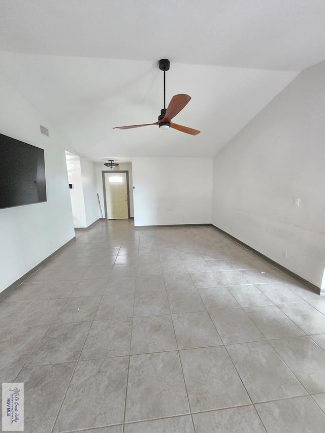 4727 Las Palomas St, Brownsville, TX 78521 - unfurnished living room featuring lofted ceiling, a ceiling fan, and tile patterned flooring
