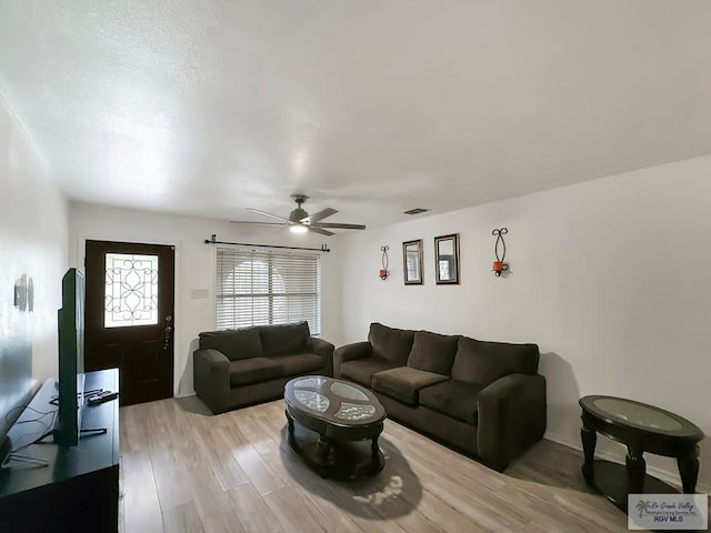 700 N Illinois Ave, Weslaco, TX 78596 - living area featuring a ceiling fan and light wood-style flooring