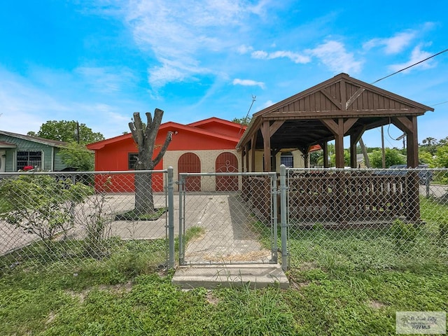 700 N Illinois Ave, Weslaco, TX 78596 - view of front facade with a gate, a gazebo, and a garage
