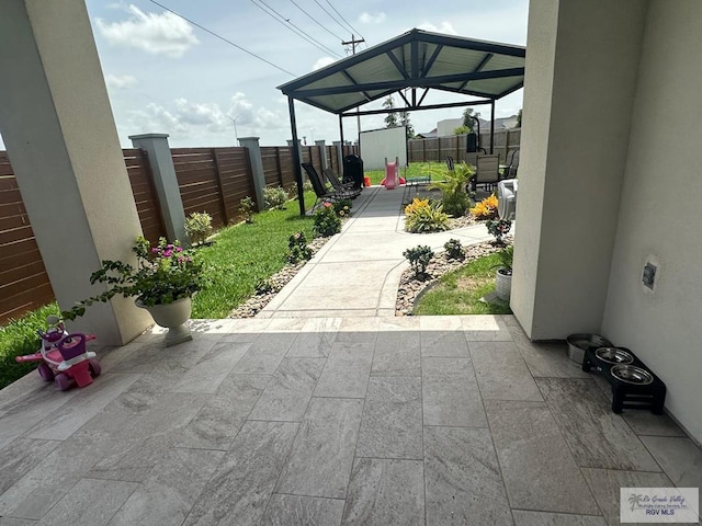 1992 Lulu St, Brownsville, TX 78577 - fenced backyard with a patio area