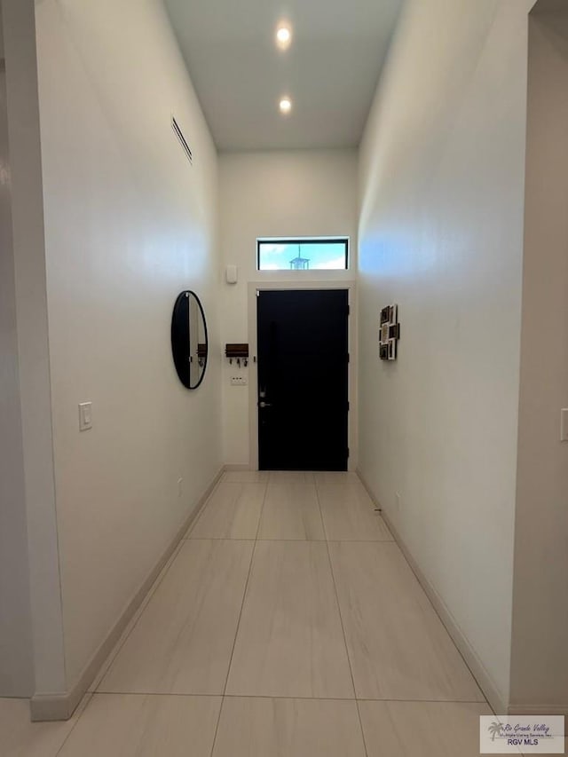 1992 Lulu St, Brownsville, TX 78577 - hallway featuring baseboards, recessed lighting, and light tile patterned floors