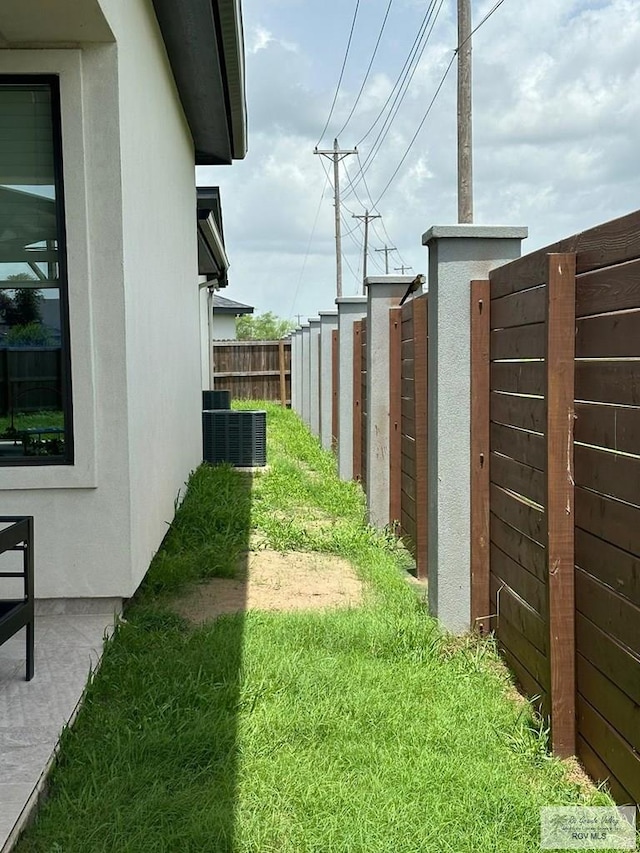 1992 Lulu St, Brownsville, TX 78577 - view of yard featuring central AC