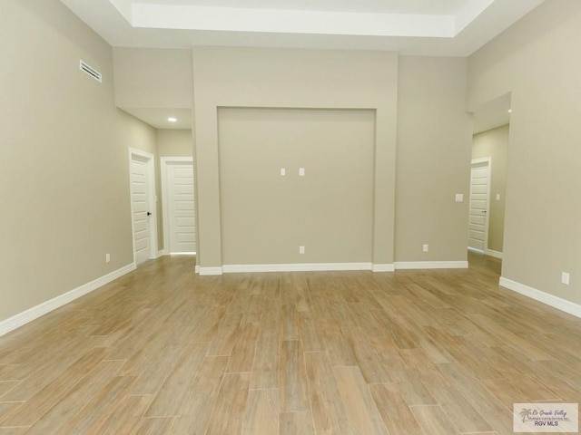 unfurnished room with light wood-type flooring