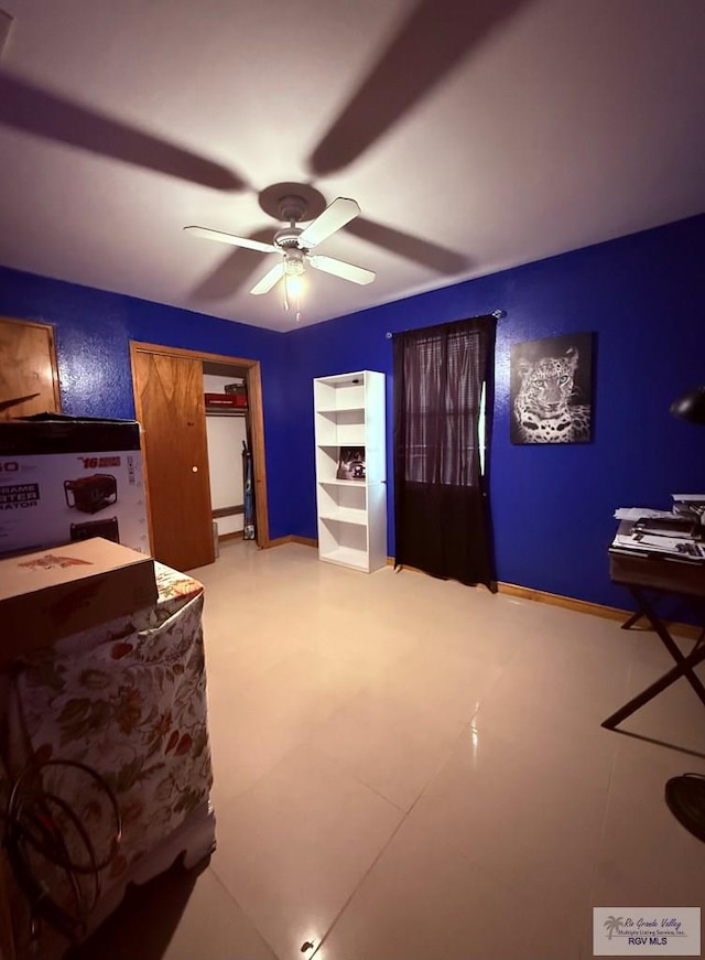 bedroom with baseboards and ceiling fan