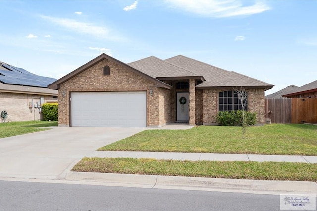 ranch-style house with a garage and a front lawn