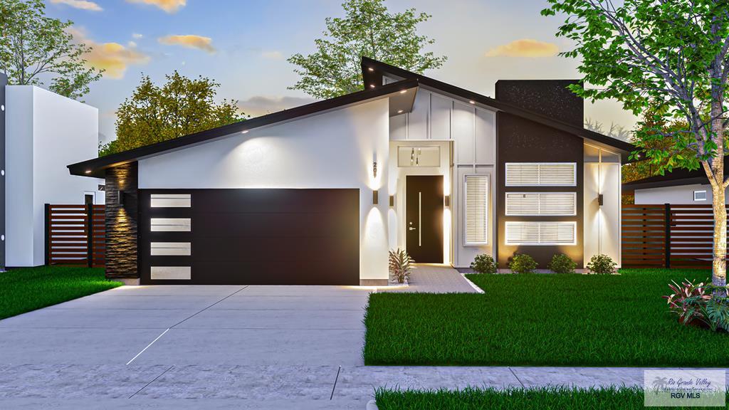 209 Cameo Dr, San Benito, TX 78586 - contemporary house featuring an attached garage, driveway, board and batten siding, and stucco siding