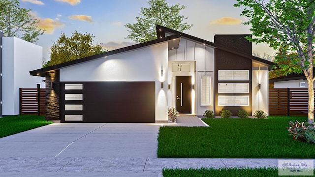 209 Cameo Dr, San Benito, TX 78586 - contemporary house featuring an attached garage, driveway, board and batten siding, and stucco siding