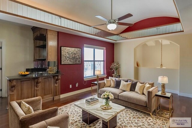 2410 E 21st St, Mission, TX 78572 - living room featuring vaulted ceiling, wood finished floors, baseboards, and a ceiling fan