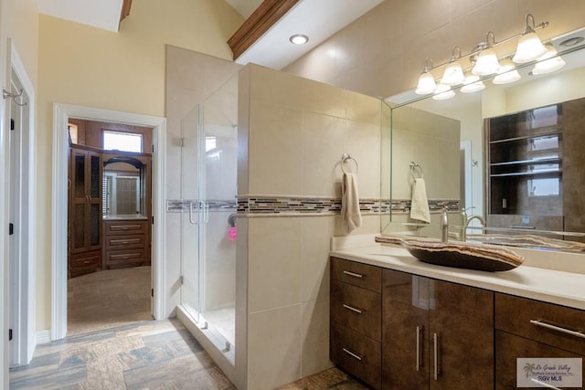 2410 E 21st St, Mission, TX 78572 - bathroom featuring vanity and a shower stall