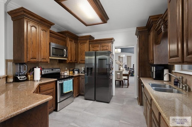 kitchen featuring sink, decorative backsplash, ornamental molding, light stone counters, and stainless steel appliances