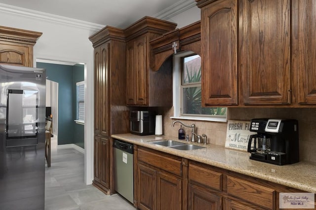 kitchen with light stone countertops, tasteful backsplash, ornamental molding, stainless steel appliances, and sink