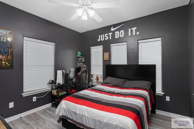 bedroom featuring ceiling fan and wood-type flooring