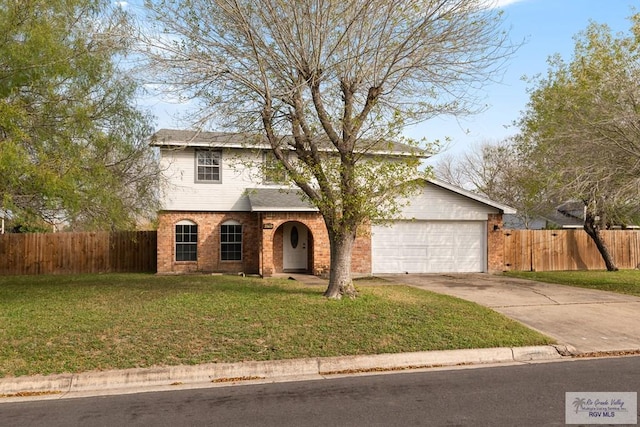 view of front of property with a garage and a front lawn