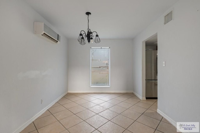 unfurnished dining area with an inviting chandelier, a wall mounted AC, and light tile patterned floors